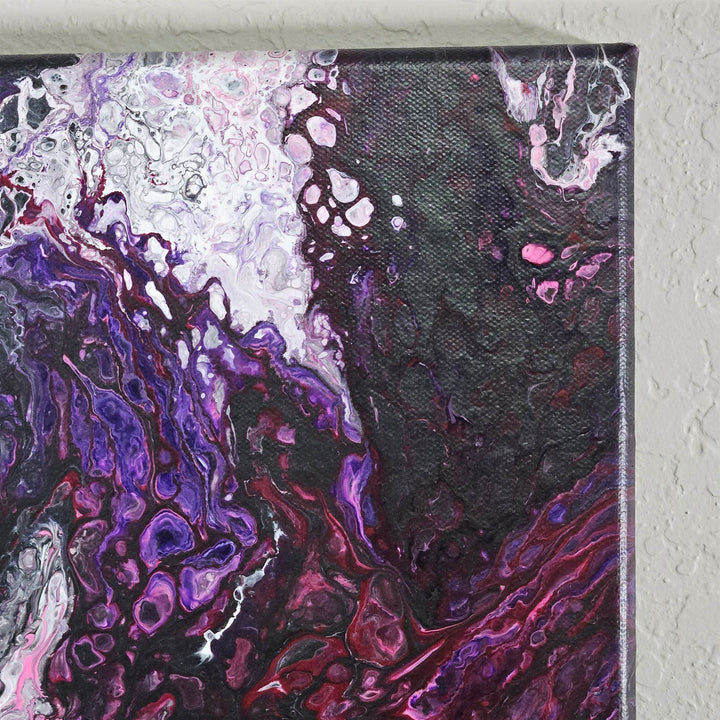 Upper right corner of Explosion acrylic pour painting featuring bold lacing effects and soft pink hues.