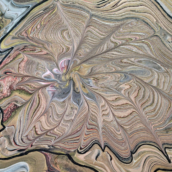 Center of Snail acrylic pour painting, emphasizing the natural movement of the wreck-a-ring technique.